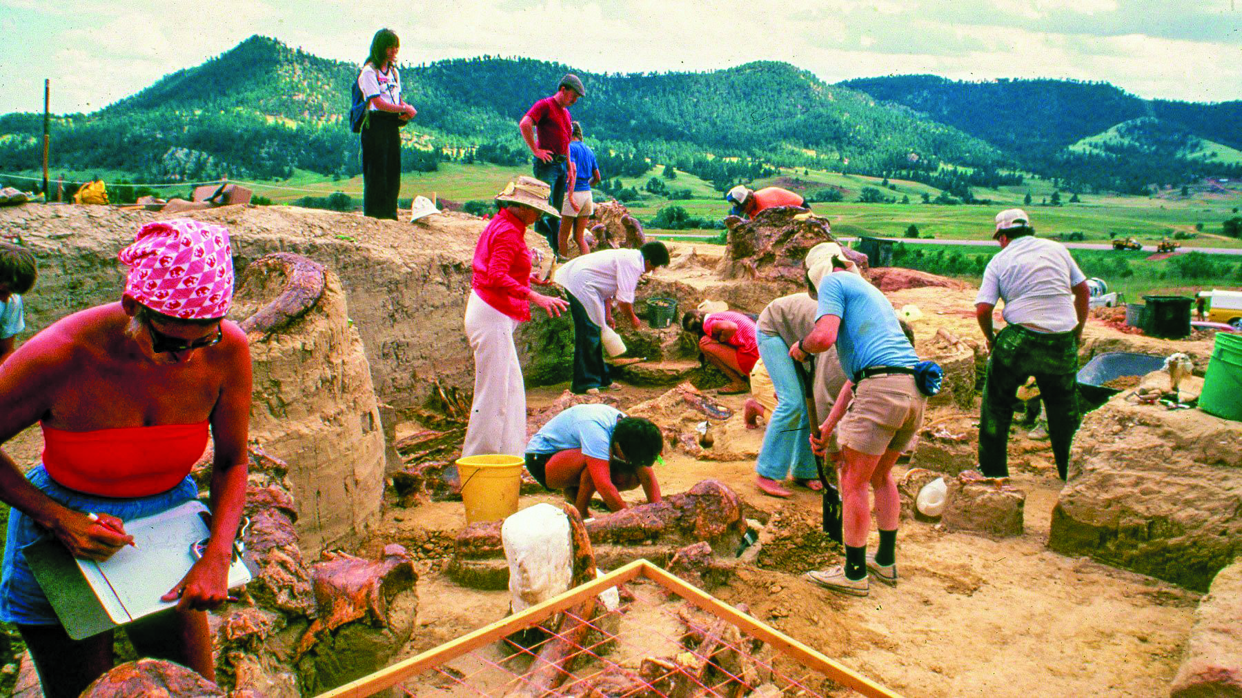 Excavators work to uncover mammoth bones during the early days of The Mammoth Site of Hot Springs, South Dakota. This week, the attraction and scientific site is celebrating its 50th anniversary with two celebrations on Friday and Saturday, June 21-22.