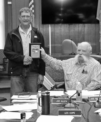 Randy Seiler accepts a plaque from Fall River County Commission Chair Joe Falkenburg during last week’s county commission meeting. Photo by Cathy Nelson