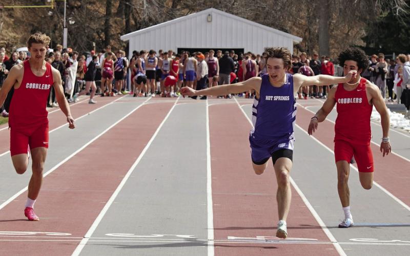 After missing most of last season due to injury, Hot Springs senior speedster Braden Peterson breaks the finish line of the 100-meters to win the event in his first meet of the 2024 season. His time of 10.94 was also a new personal-record. The current school record in the 100-meters is 10.71, which was set by Joe Beehler in 2004. Photos by Tim Potts/Black Hills Pioneer