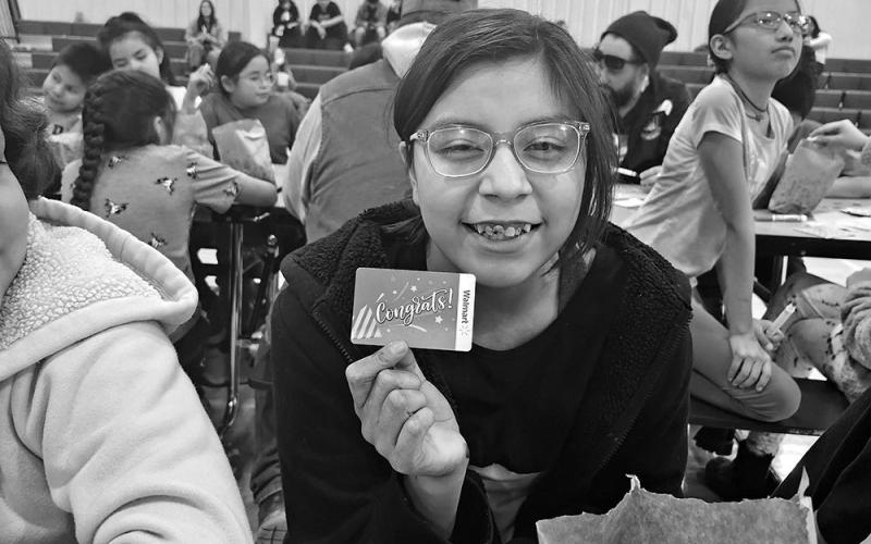 Sara Brown Bull shows off the $25 gift card she won at Friday Fun Bingo on February 23 at the Oelrichs School. Photo by Katie Merdanian/Fall River County Herald/Star