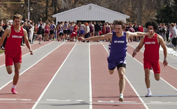 After missing most of last season due to injury, Hot Springs senior speedster Braden Peterson breaks the finish line of the 100-meters to win the event in his first meet of the 2024 season. His time of 10.94 was also a new personal-record. The current school record in the 100-meters is 10.71, which was set by Joe Beehler in 2004. Photos by Tim Potts/Black Hills Pioneer