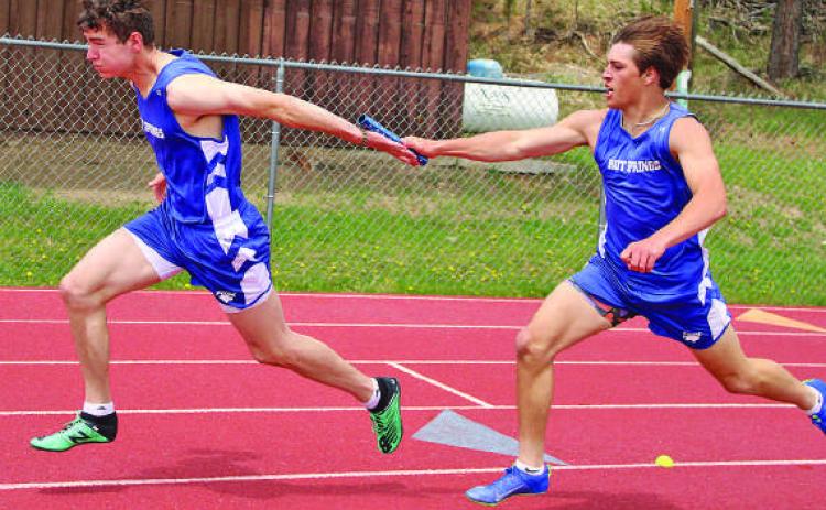 Hot Springs’ Hunter Kunz hands off the baton to Luke Haertel in the 4x200m relay at last week’s Last Chance Meet in Custer. Photo by Jason Ferguson/Custer County Chronicle